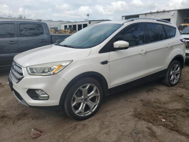 FORD ESCAPE TIT 2017 with VIN 1FMCU9J9XHUD02060 - Photo from auction
