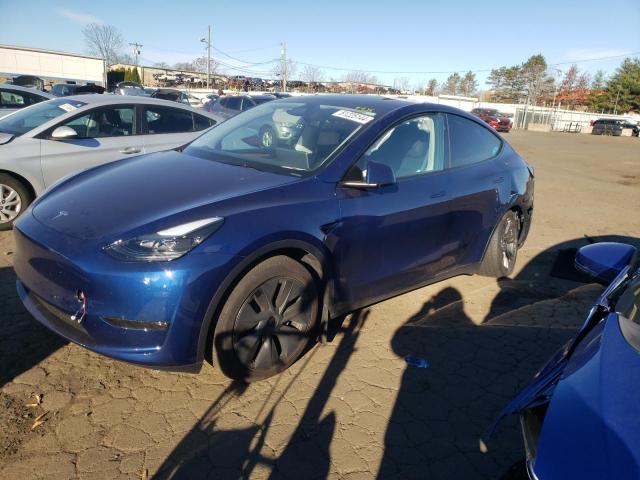 TESLA MODEL Y 2024 with VIN 7SAYGDEE0RA320055 - Photo from auction