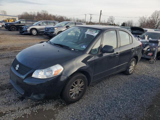 SUZUKI SX4 LE 2012 with VIN JS2YC5A32C6302316 - Photo from auction