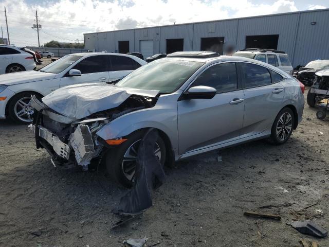 HONDA CIVIC EXL 2018 with VIN JHMFC1F79JX034487 - Photo from auction