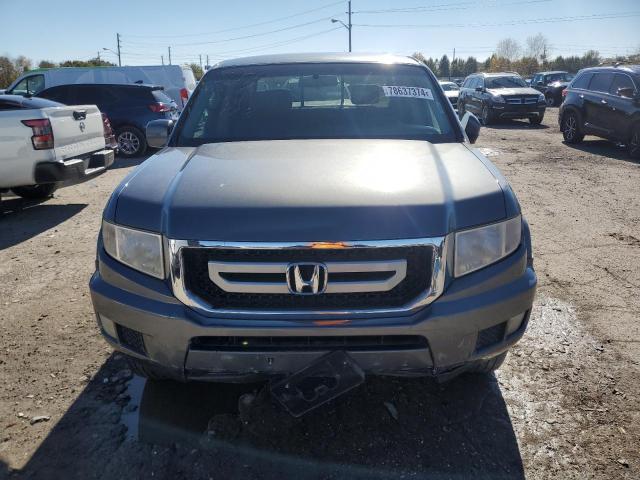 Photo 5 from auction – 2011 HONDA RIDGELINE with VIN 5FPYK1F43BB004326