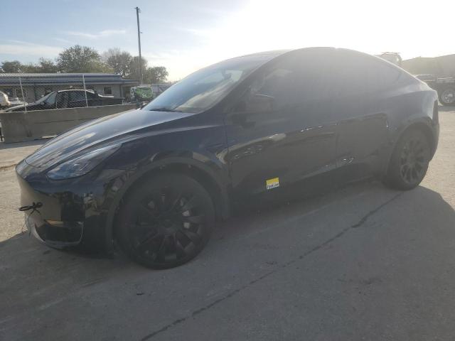 TESLA MODEL Y 2023 with VIN 7SAYGAEE2PF668907 - Photo from auction