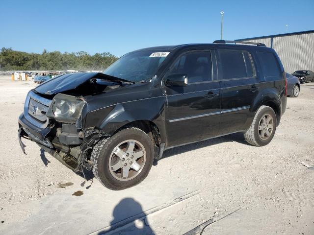 HONDA PILOT TOUR 2011 with VIN 5FNYF3H92BB003864 - Photo from auction