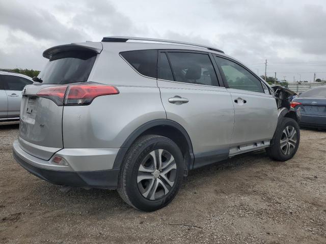 Photo 3 from auction – 2018 TOYOTA RAV4 LE with VIN JTMZFREV9JJ212857