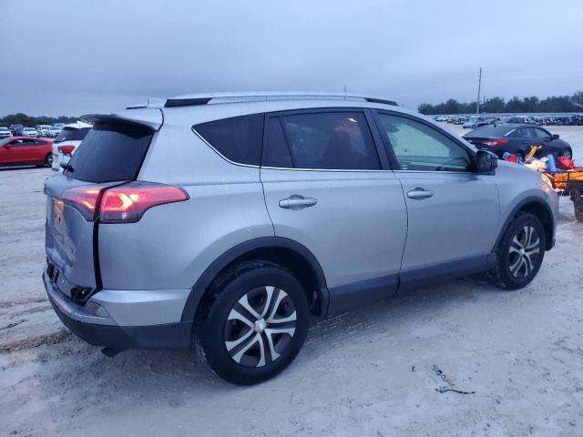 Photo 3 from auction – 2018 TOYOTA RAV4 LE with VIN JTMZFREV2JD111593