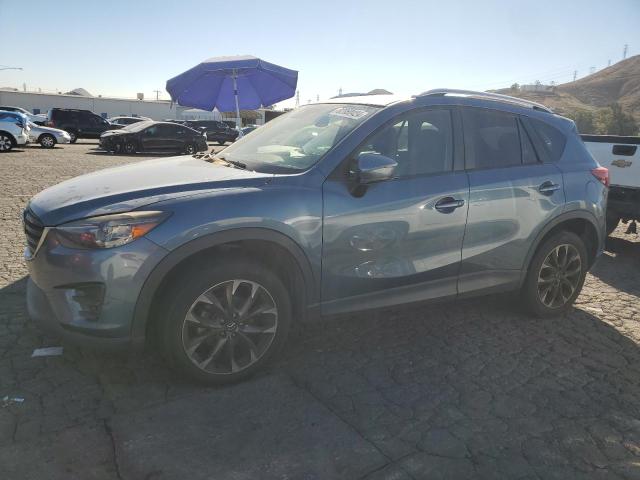 MAZDA CX-5 GT 2016 with VIN JM3KE2DY8G0644790 - Photo from auction