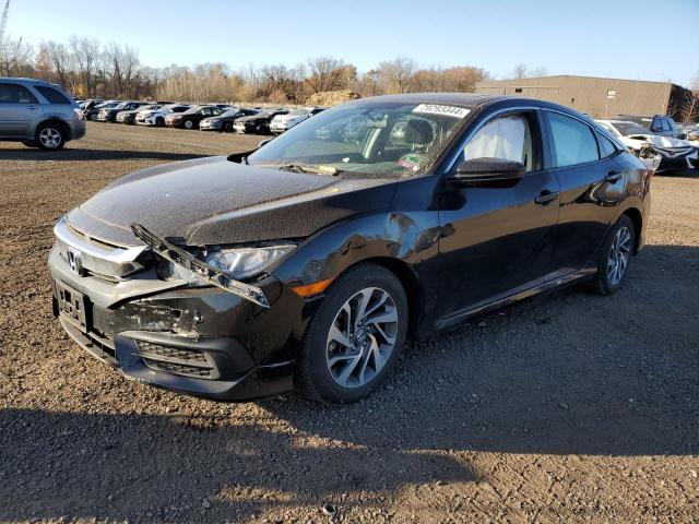 HONDA CIVIC EX 2018 with VIN 2HGFC2F74JH528012 - Photo from auction