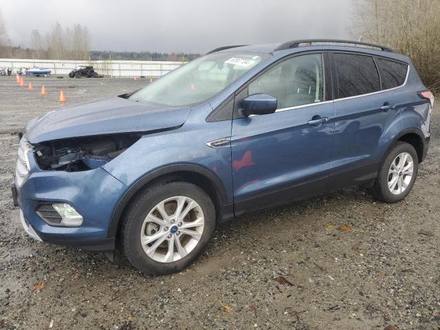 FORD ESCAPE SE 2018 with VIN 1FMCU9GD3JUC10113 - Photo from auction