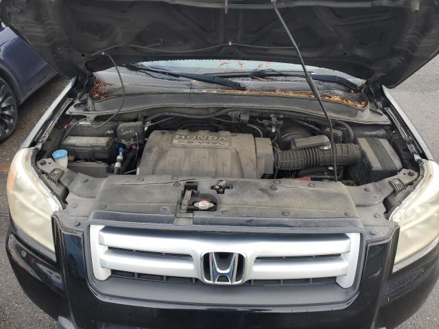 Photo 12 from auction – 2006 HONDA PILOT EX with VIN 2HKYF18526H537164