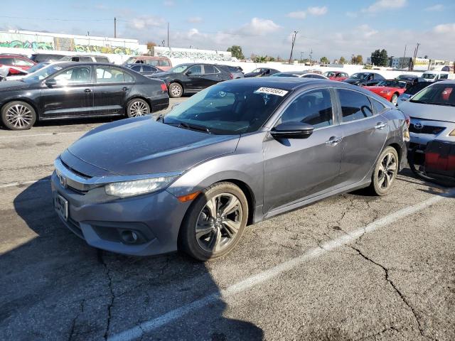 HONDA CIVIC TOUR 2016 with VIN 2HGFC1F99GH631530 - Photo from auction