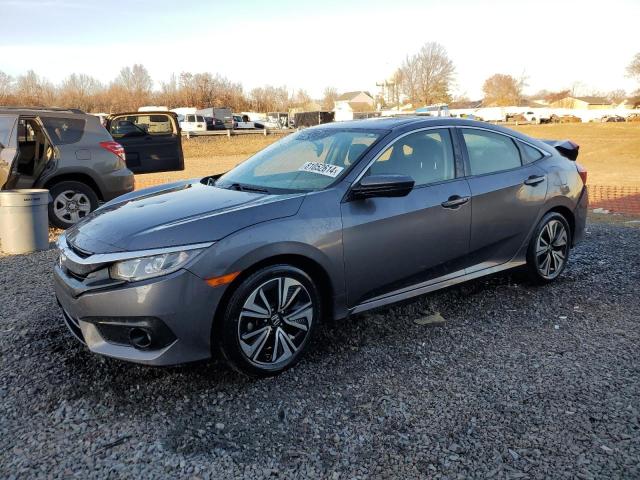 HONDA CIVIC EX 2018 with VIN JHMFC1F42JX030951 - Photo from auction