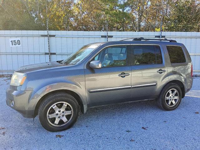 HONDA PILOT TOUR 2010 with VIN 5FNYF3H93AB018002 - Photo from auction