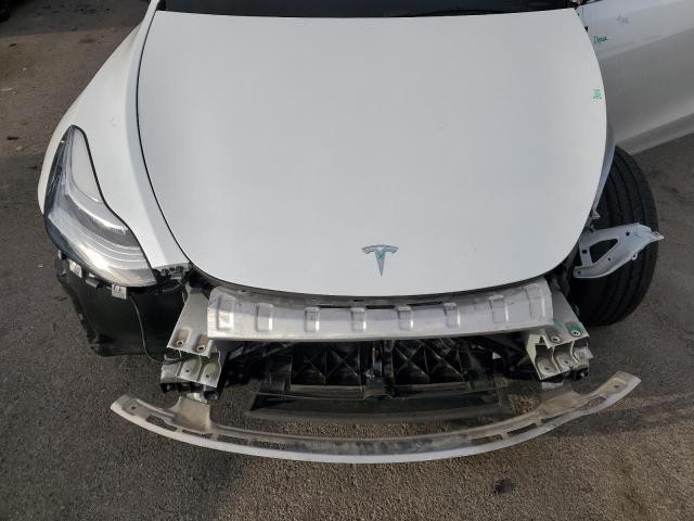 Photo 11 from auction – 2023 TESLA MODEL Y with VIN 7SAYGDEE1PA067681