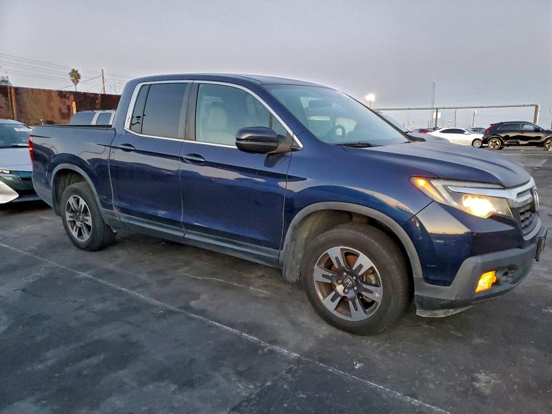 Photo 4 from auction – 2017 HONDA RIDGELINE with VIN 5FPYK3F58HB006179