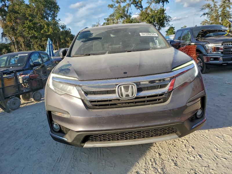 Photo 5 from auction – 2021 HONDA PILOT TOUR with VIN 5FNYF5H97MB023008