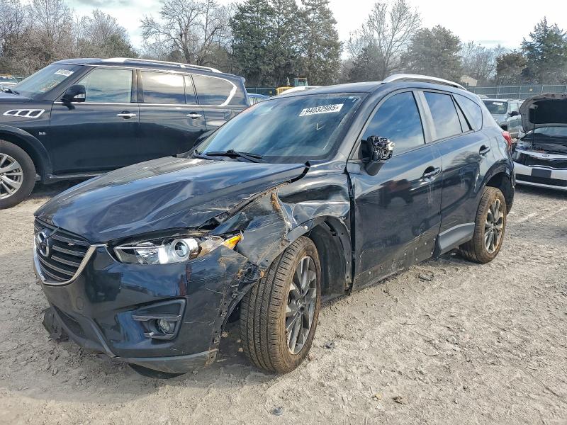 MAZDA CX-5 GT 2016 with VIN JM3KE4DY1G0871797 - Photo from auction
