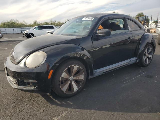 VOLKSWAGEN BEETLE 2014 with VIN 3VWFP7AT2EM611060 - Photo from auction