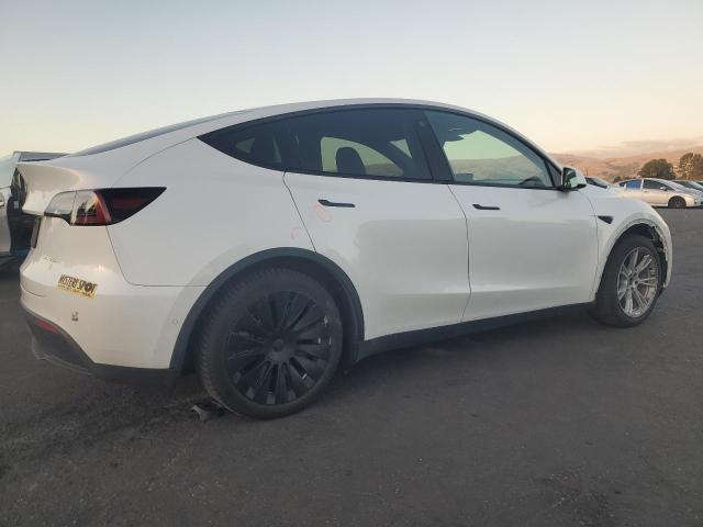 Photo 3 from auction – 2022 TESLA MODEL Y with VIN 7SAYGAEE2NF403918