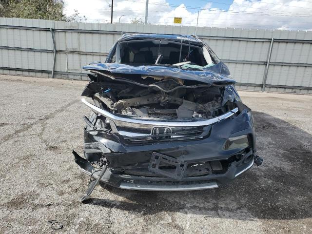 Photo 5 from auction – 2021 HONDA PILOT TOUR with VIN 5FNYF5H65MB038435