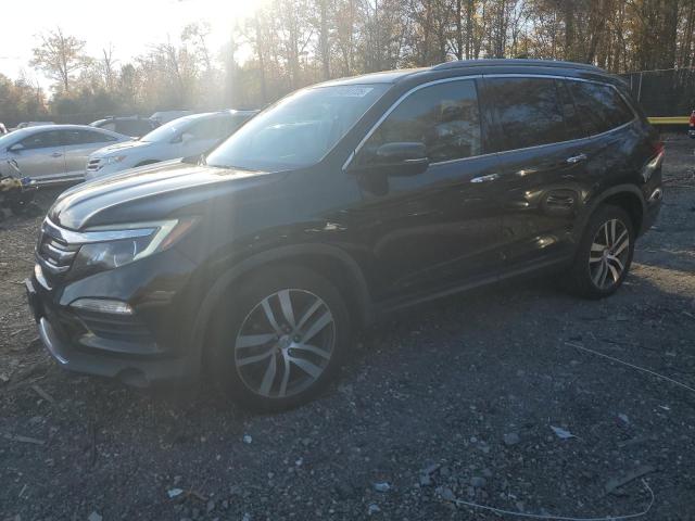 HONDA PILOT TOUR 2016 with VIN 5FNYF6H92GB081487 - Photo from auction