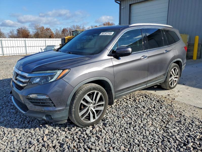 HONDA PILOT TOUR 2017 with VIN 5FNYF6H95HB046962 - Photo from auction