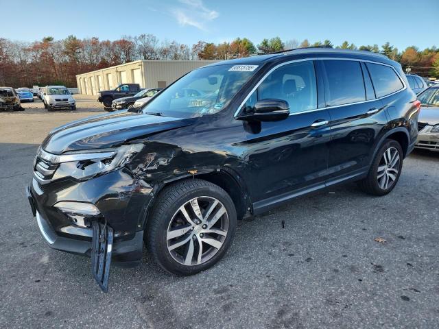 HONDA PILOT TOUR 2017 with VIN 5FNYF6H94HB101546 - Photo from auction
