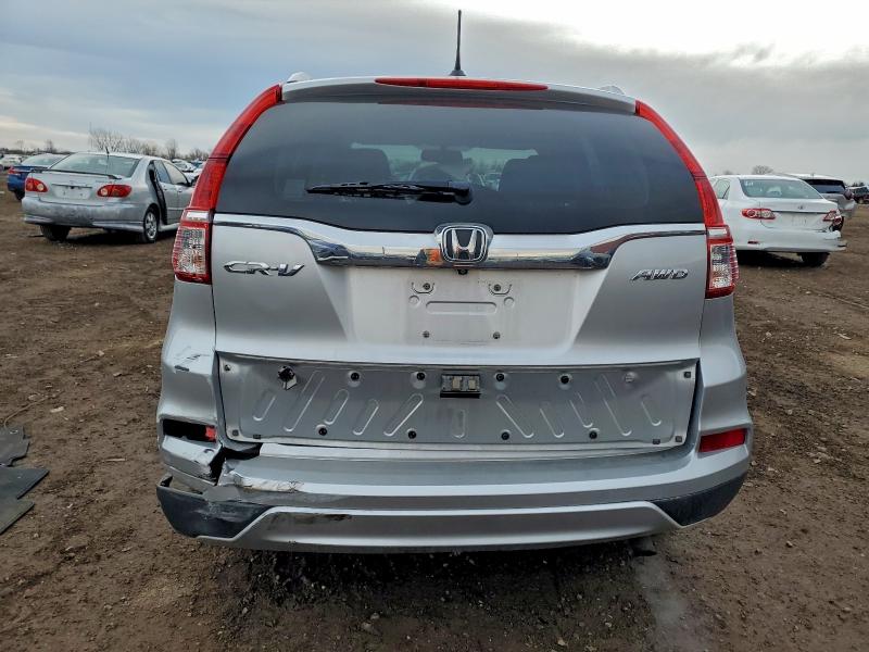 Photo 6 from auction – 2015 HONDA CR-V with VIN 5J6RM4H75FL077114