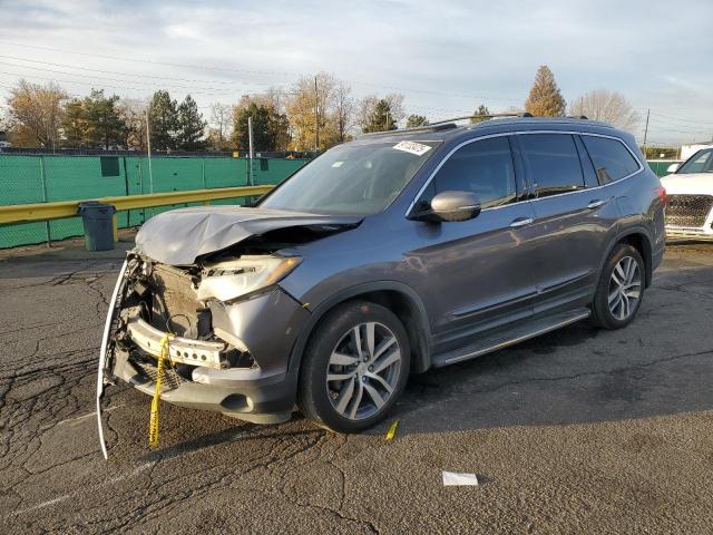HONDA PILOT TOUR 2017 with VIN 5FNYF6H90HB035514 - Photo from auction