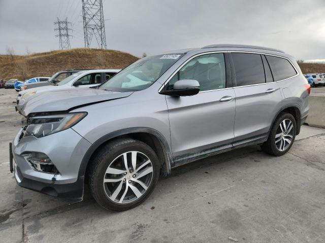 HONDA PILOT TOUR 2017 with VIN 5FNYF6H90HB090738 - Photo from auction