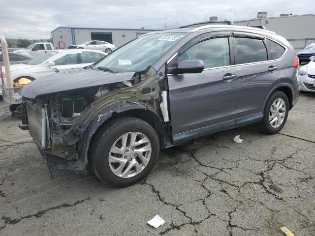 Photo 1 from auction – 2015 HONDA CR-V EXL with VIN 5J6RM4H79FL028241