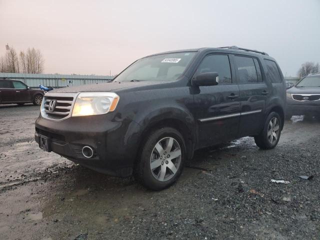 HONDA PILOT TOUR 2015 with VIN 5FNYF4H95FB009539 - Photo from auction