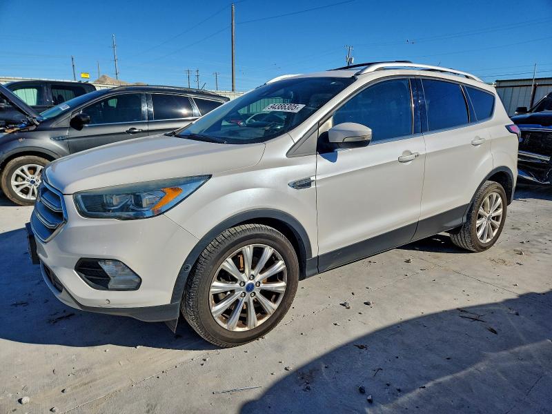 FORD ESCAPE TIT 2017 with VIN 1FMCU0J98HUD10069 - Photo from auction