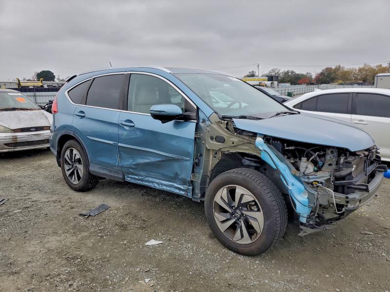 Photo 4 from auction – 2015 HONDA CR-V with VIN 5J6RM4H96FL047590