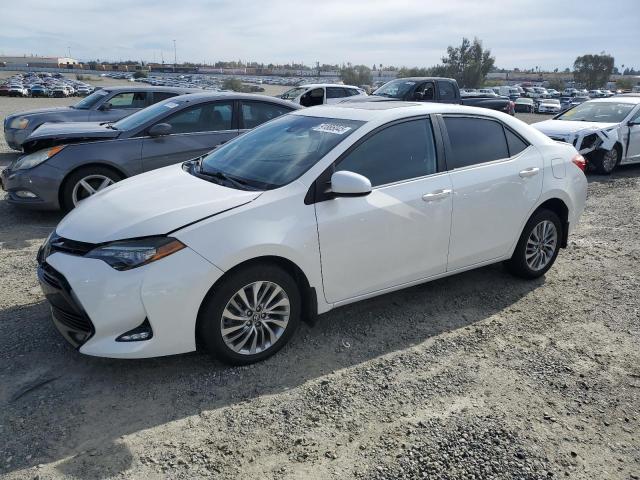 TOYOTA COROLLA LE 2017 with VIN 5YFBPRHE9HP571447 - Photo from auction