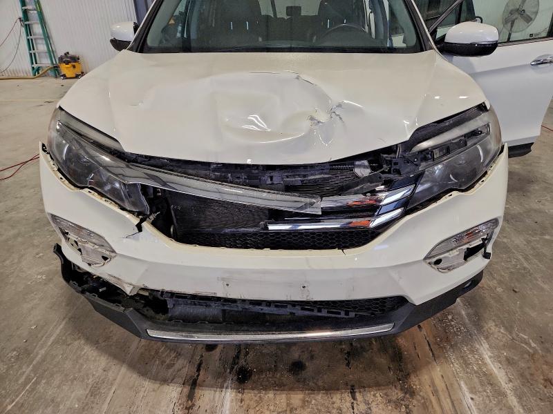 Photo 12 from auction – 2017 HONDA PILOT with VIN 5FNYF6H06HB060371