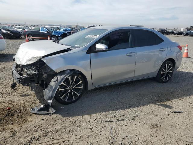 TOYOTA COROLLA L 2019 with VIN 5YFBURHE5KP931071 - Photo from auction