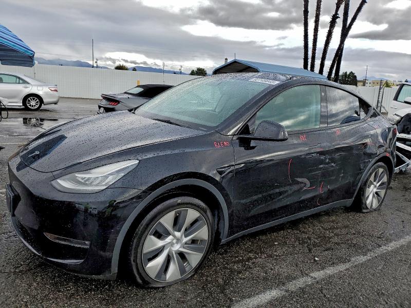 TESLA MODEL Y 2022 with VIN 7SAYGAEE8NF389698 - Photo from auction