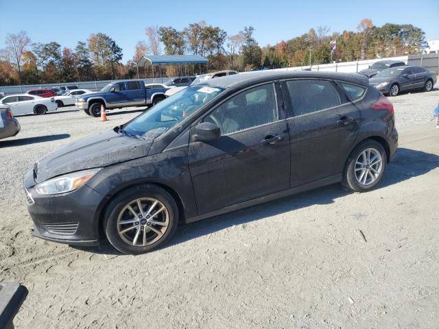 FORD FOCUS SE 2018 with VIN 1FADP3K22JL284590 - Photo from auction