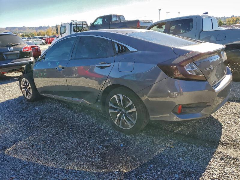 Photo 2 from auction – 2017 HONDA CIVIC LX with VIN 2HGFC2F51HH504162
