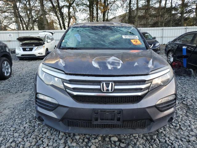 Photo 5 from auction – 2018 HONDA PILOT LX with VIN 5FNYF5H15JB028018