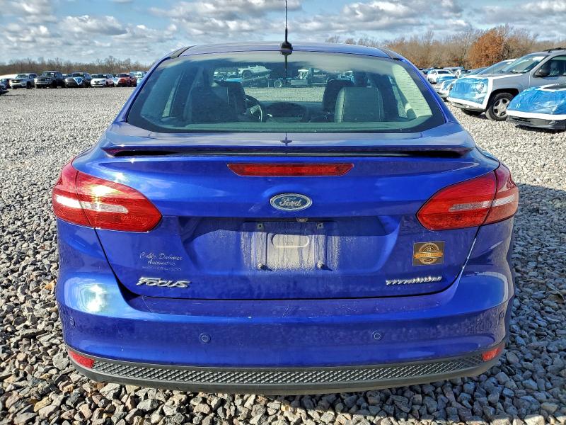 Photo 6 from auction – 2015 FORD FOCUS TITA with VIN 1FADP3J25FL256940