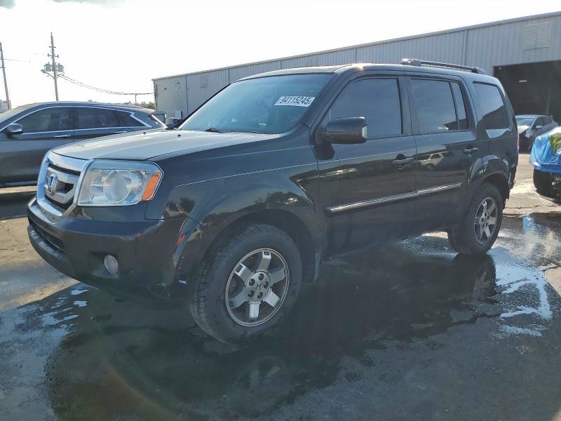 HONDA PILOT TOUR 2011 with VIN 5FNYF3H91BB048696 - Photo from auction