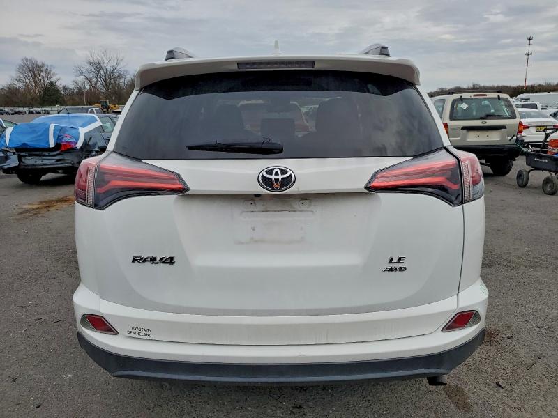 Photo 6 from auction – 2018 TOYOTA RAV4 LE with VIN 2T3BFREV2JW851357