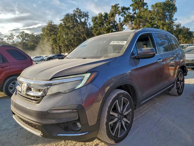 Photo 1 from auction – 2021 HONDA PILOT TOUR with VIN 5FNYF5H97MB023008