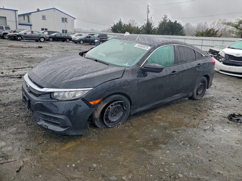 HONDA CIVIC LX 2018 with VIN 2HGFC2F57JH606233 - Photo from auction