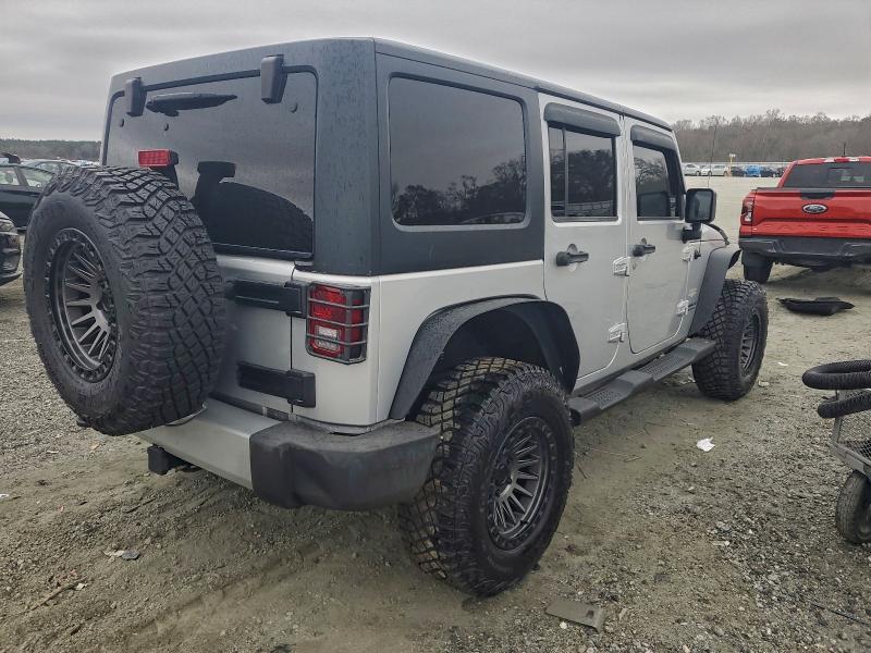 Photo 3 from auction – 2011 JEEP WRANGLER U with VIN 1J4BA5H15BL505124