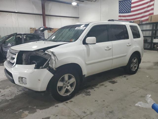 HONDA PILOT EXL 2011 with VIN 5FNYF4H65BB009752 - Photo from auction