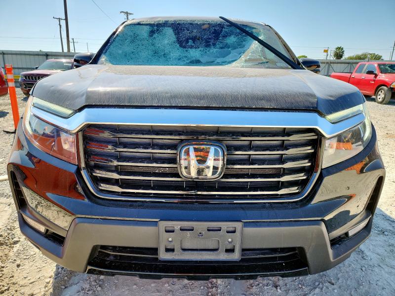 Photo 5 from auction – 2023 HONDA RIDGELINE with VIN 5FPYK3F77PB065787