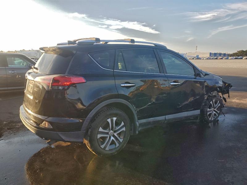 Photo 3 from auction – 2018 TOYOTA RAV4 LE with VIN 2T3ZFREVXJW451111