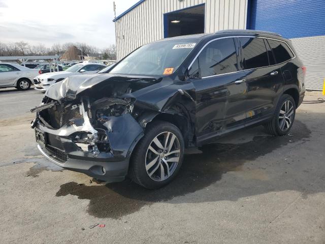 HONDA PILOT TOUR 2017 with VIN 5FNYF6H90HB036937 - Photo from auction